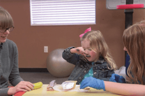 ABC Pediatric Therapy Gross motor skills eating with a spoon