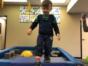 ABC Pediatric Therapy boy in weighted vest walking