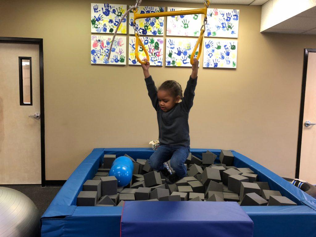 ABC Pediatric Therapy Boy on trapeze swing