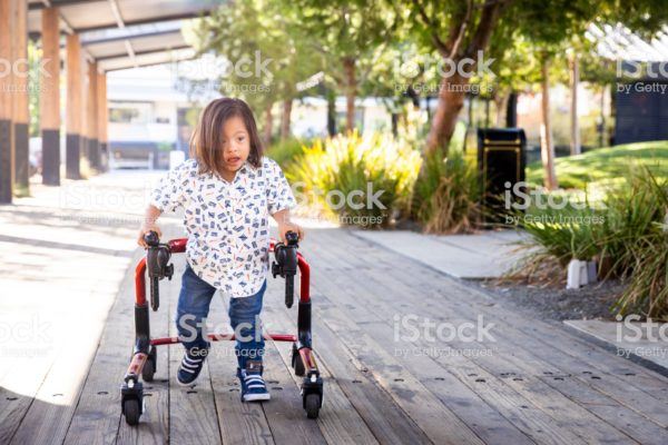 Young Boy with Down's Syndrome Walking on the path. Young Boy with Down's Syndrome Walking on the path.